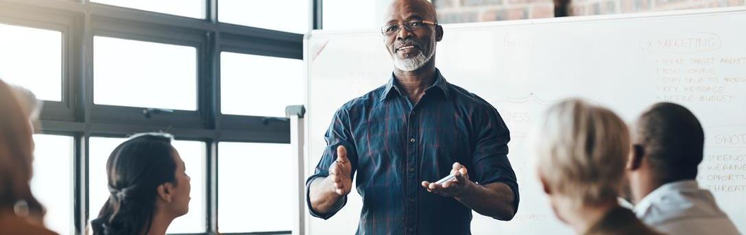 Man leading a training in a conference room